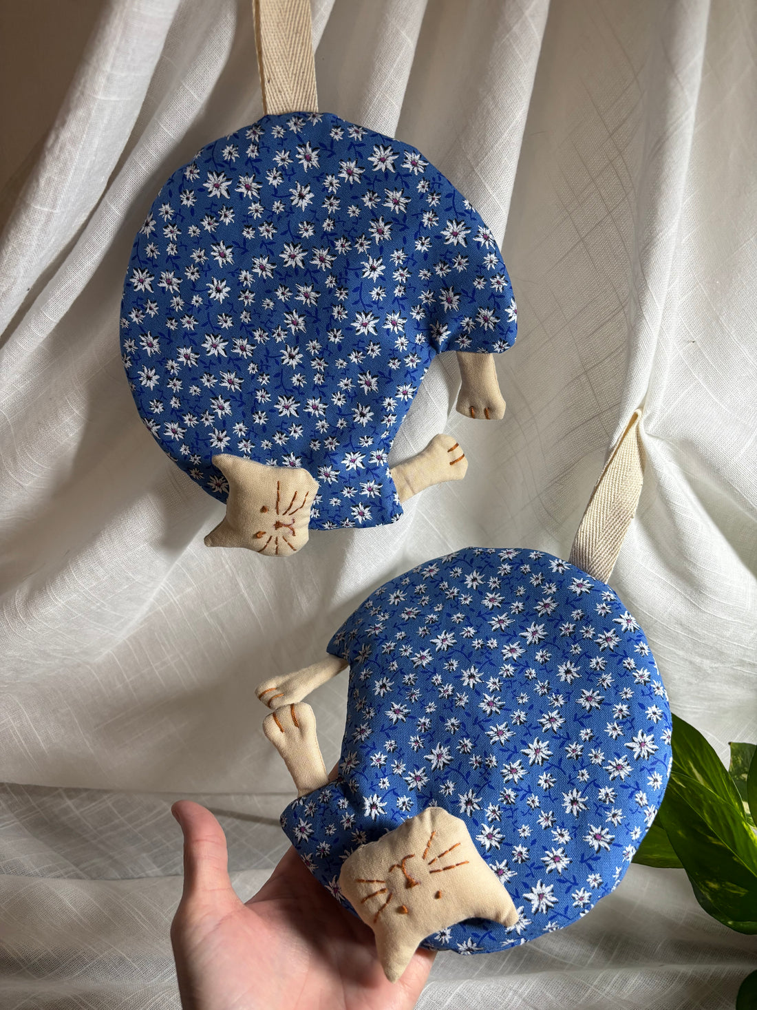 Blue Dolomites fabric cat potholders, set of 2