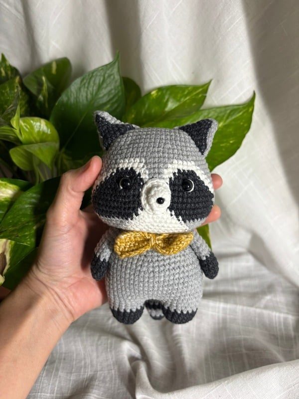 Crocheted grey raccoon with a mustard bow tie — Full view